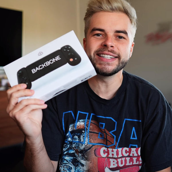 Man holding a backbone box controller
